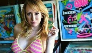 Brett Rossi fingers her pussy in striped OTK socks atop pinball machine on leaks.pics