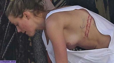 Amber Heard caught topless on the beach on leaks.pics