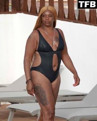 Sandi Bogle Shows Off Her Voluptuous Figure in a Swimsuit Poolside Out in Ibiza on leaks.pics