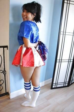 Tiny Asian cheerleader May Lee posing in cute uniform and socks on leaks.pics