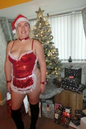 Busty blonde Barby masturbates her shaved pussy near the Christmas tree on leaks.pics