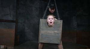 Blonde girl Odette Delacroix is made to suck a black cock with head in stocks on leaks.pics