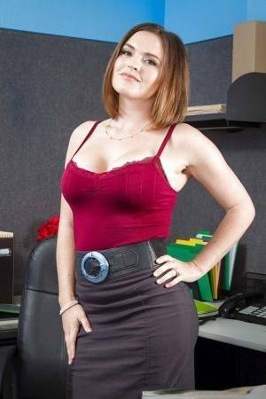 Secretary Krissy Lynn shows her fuckable booty in the office on leaks.pics