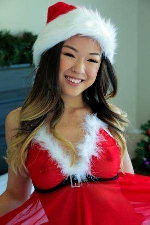 Cute Asian teen Lulu Chu wears Xmas lingerie during sex on a bed on leaks.pics